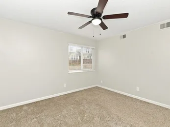 Primary bedroom at Riverbend Apartments